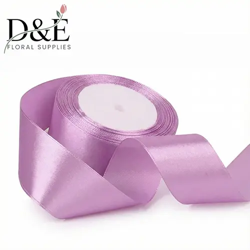 Lilac 1.5 inch single face satin ribbon roll on white background
