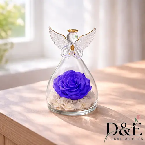 Purple preserved rose displayed inside an angel glass bottle