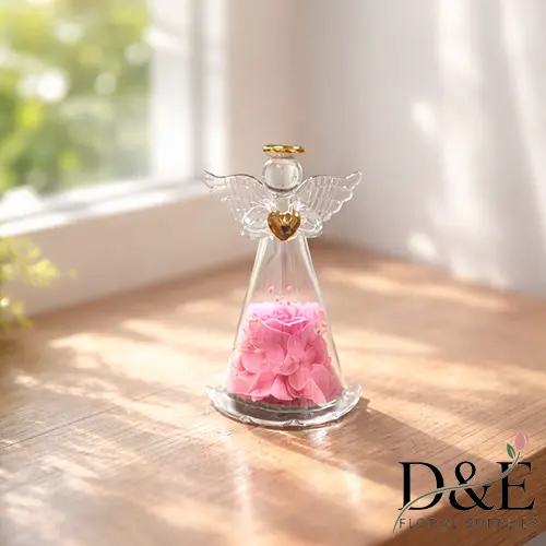 Mini Angel Eternity Pink Rose Mini pink preserved flower displayed inside an angel glass bottle