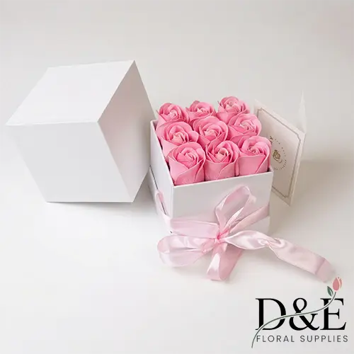 Small white flower box with artificial pink roses Mother's Day small floral gift box with pink roses